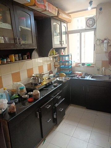 Kitchen in 2 BHK Apartment at Mittal Rajnagar Residency, Raj Nagar Extension – for Rent