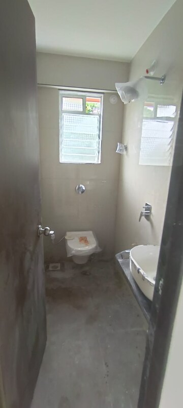 Bathroom in 2 BHK Apartment at Laxmi Narayan Tower, Naupada – for Rent