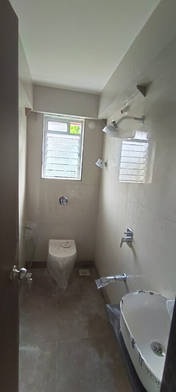 Bathroom in 2 BHK Apartment at Laxmi Narayan Tower, Naupada – for Rent