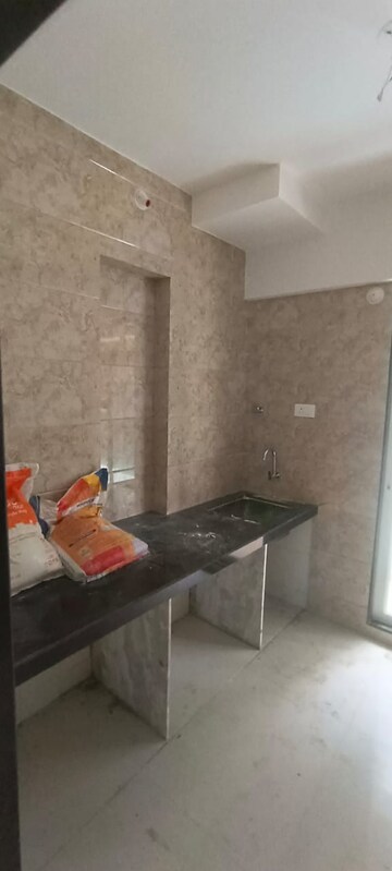 Kitchen in 2 BHK Apartment at Laxmi Narayan Tower, Naupada – for Rent