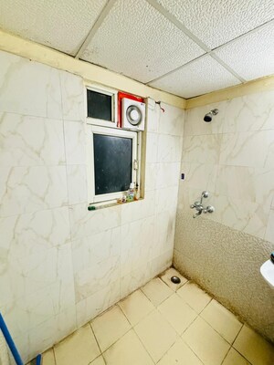 Bathroom in 3.5 BHK Apartment at Aims Golf City, Sector 75 – for Sale
