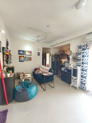 Living Room in 3.5 BHK Apartment at Aims Golf City, Sector 75 – for Rent
