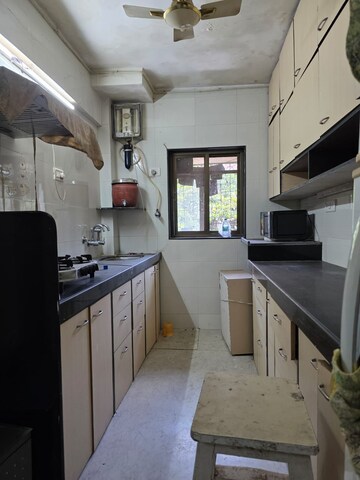 Kitchen in 2 BHK Apartment at Nav Swa Gharkul CHS, Santacruz East – for Rent