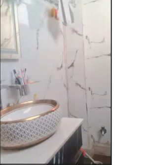 Bathroom in 4 BHK Builder Floor at Mansarover Garden – for Sale