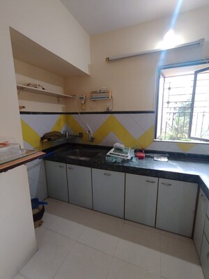 Kitchen in 1 BHK Apartment at Garden Court, Waghbil – for Rent