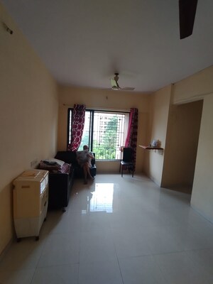 Living Room in 1 BHK Apartment at Garden Court, Waghbil – for Rent