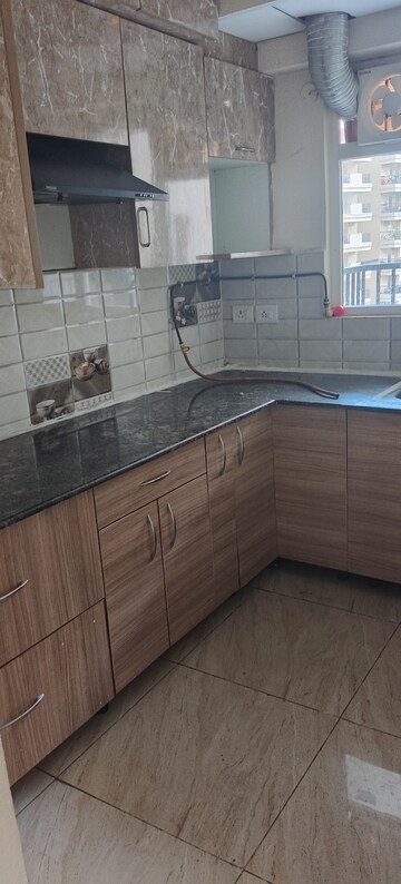 Kitchen in 2 BHK Apartment at Gaur City 2 - 14th Avenue, Sector 16c Greater Noida – for Rent