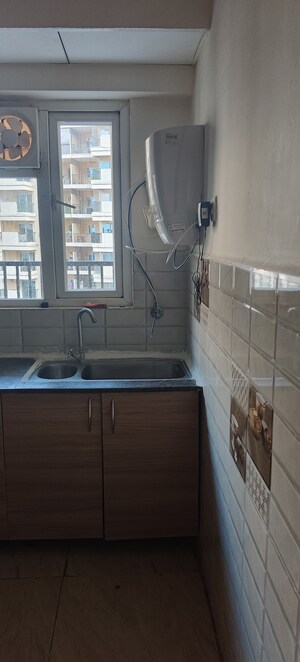Kitchen in 2 BHK Apartment at Gaur City 2 - 14th Avenue, Sector 16c Greater Noida – for Rent