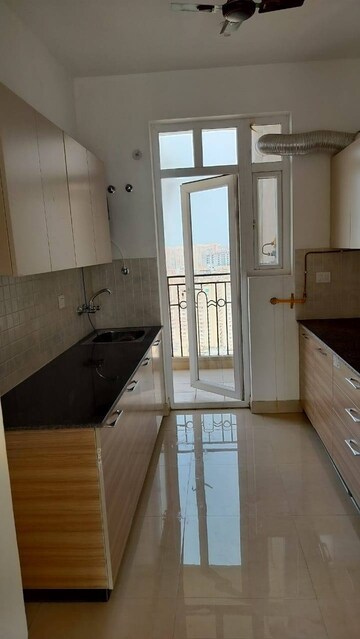 Kitchen in 3 BHK Apartment at ATS Nobility, Sector 4 Greater Noida – for Rent