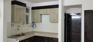Kitchen in 2 BHK Apartment at Signature Orchard Avenue 2, Sector 93 – for Sale
