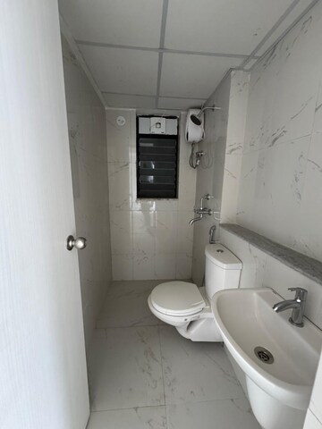 Bathroom in 2 BHK Apartment at Runwal Gardens Phase 2, Dombivli East – for Rent