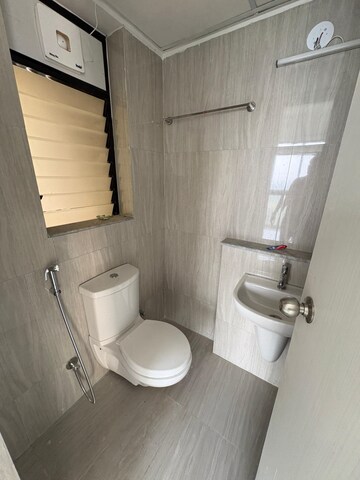 Bathroom in 1 BHK Apartment at Runwal Gardens Phase 2, Dombivli East – for Rent