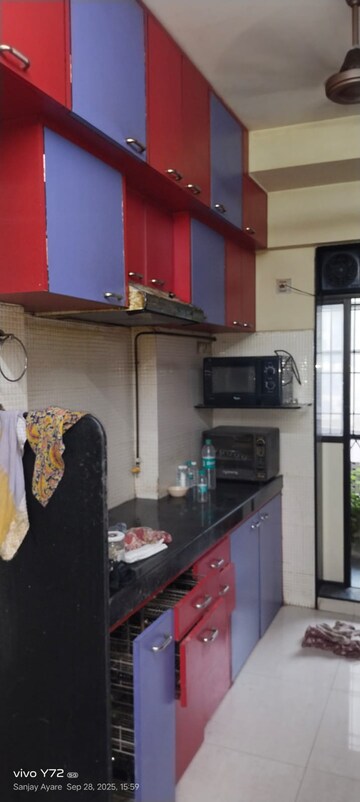Kitchen in 2 BHK Apartment at Globe Heights, Goregaon East – for Sale