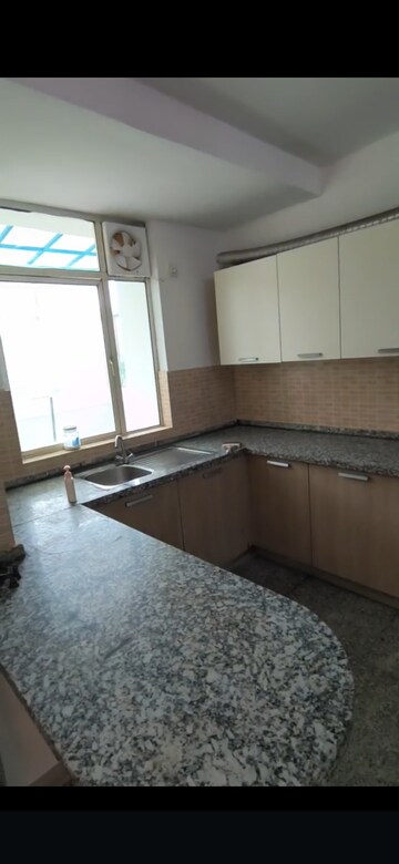 Kitchen in 3 BHK Apartment at Raheja Vedaanta, Sector 108 – for Rent