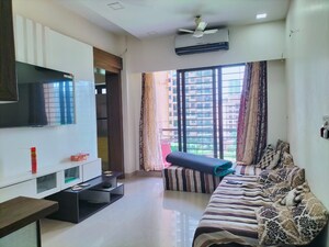 Living Room in 1 BHK Apartment at K Raheja Heights, Malad East – for Rent