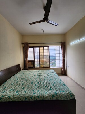 Bedroom in 2 BHK Apartment at Raheja Willows, Kandivali East – for Sale