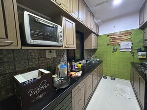 Kitchen in 2 BHK Apartment at Woodland Apartment, Andheri West – for Rent