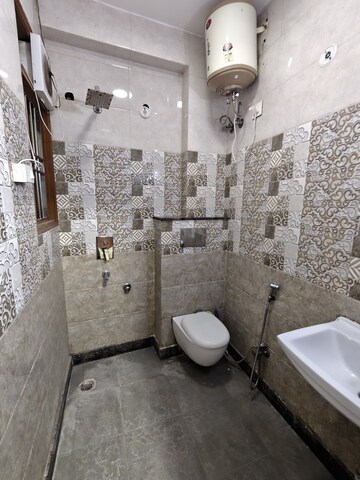 Bathroom in 3 BHK Builder Floor at Khirki Extension – for Rent