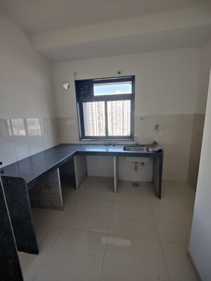 Kitchen in 1 BHK Apartment at Kanchan Pushp Society, Ghodbunder Road – for Rent