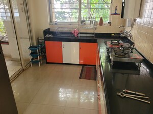 Kitchen in 2 BHK Apartment at Sharad Vaibhav, Model Colony – for Rent