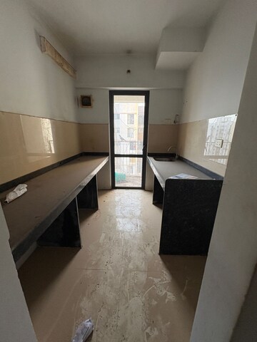 Kitchen in 2 BHK Apartment at Lodha Lakeshore Greens, Hedutane – for Sale