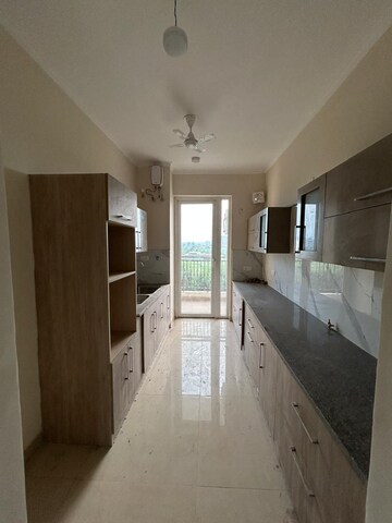 Kitchen in 4 BHK Apartment at Affinity Greens, International Airport Road – for Rent