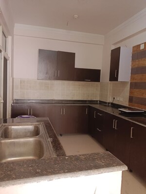 Kitchen in 4 BHK Apartment at Amrapali Platinum, Sector 119 – for Sale