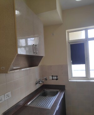 Kitchen in 2 BHK Apartment at Satya The Hermitage, Sector 103 – for Rent