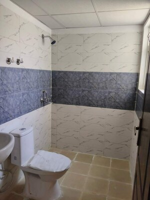 Bathroom in 2 BHK Apartment at AIMS Golf Town, Sector 4 Greater Noida – for Rent