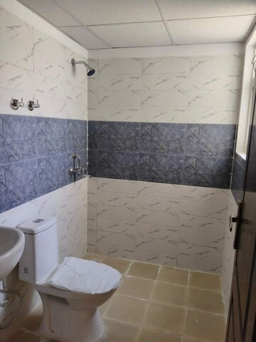 Bathroom in 2 BHK Apartment at AIMS Golf Town, Sector 4 Greater Noida – for Rent