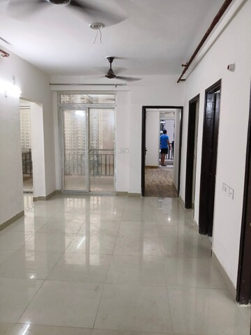 Living Room in 2 BHK Apartment at AIMS Golf Town, Sector 4 Greater Noida – for Rent