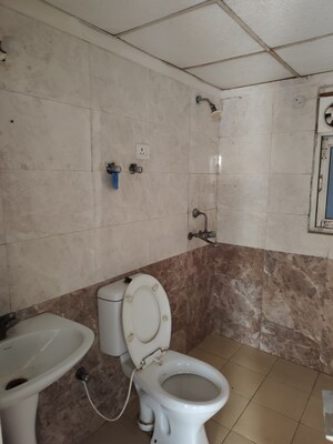 Bathroom in 2.5 BHK Apartment at Aims Golf City, Sector 75 – for Rent