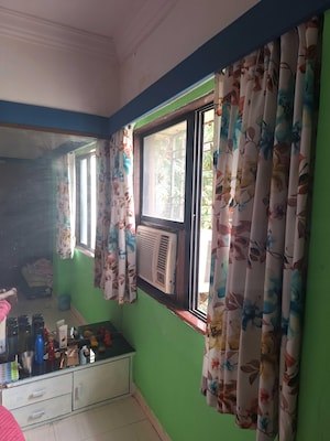 Living Room in 2 BHK Apartment at Parijat CHS Andheri West, Yari Road – for Rent