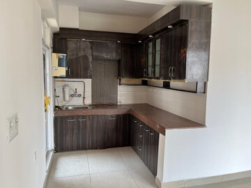 Kitchen in 2 BHK Apartment at Exotica Dreamville, Sector 16c Greater Noida – for Rent