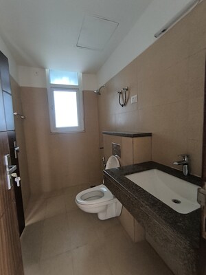 Bathroom in 3 BHK Apartment at Puri Emerald Bay, Sector 104 – for Rent