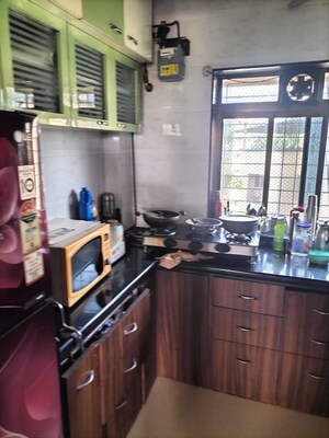 Kitchen in 2 BHK Apartment at Arogya Sadan CHS, Bhandup East – for Rent