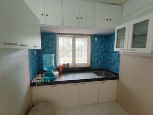 Kitchen in 2 BHK Apartment at Andheri CHS, Andheri West – for Rent