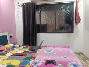 Bedroom in 2 BHK Apartment at Riddhi Gardens CHS, Malad East – for Sale
