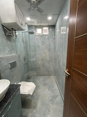 Bathroom in 4 BHK Builder Floor at Arya Chittaranjan Park, Kalkaji – for Rent