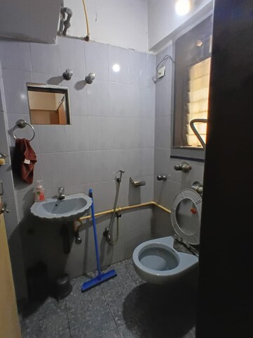Bathroom in 1 BHK Apartment at Abrol Krishna Utsav, Malad West – for Rent