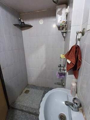 Bathroom in 1 BHK Apartment at Abrol Krishna Utsav, Malad West – for Rent