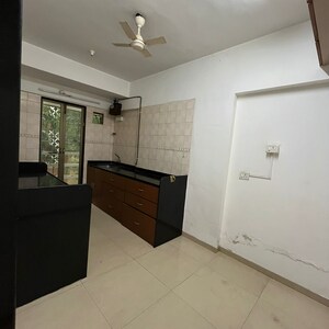 Kitchen in 3 BHK Apartment at Status CHS, Yari Road – for Rent