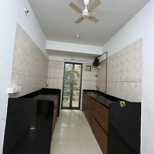 Kitchen in 3 BHK Apartment at Status CHS, Yari Road – for Rent