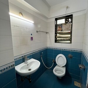 Bathroom in 3 BHK Apartment at Status CHS, Yari Road – for Rent