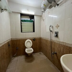 Bathroom in 3 BHK Apartment at Status CHS, Yari Road – for Rent