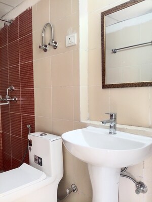 Bathroom in 3 BHK Apartment at Mahagun Mywoods, Sector 16c Greater Noida – for Rent