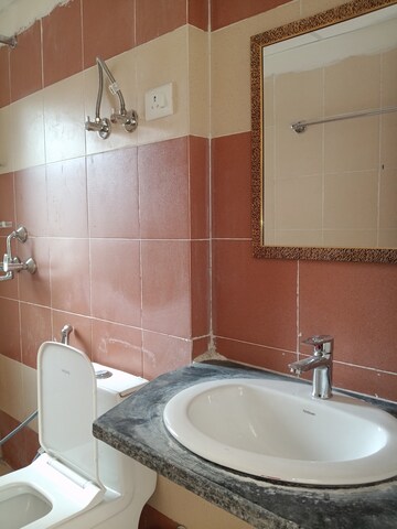 Bathroom in 3 BHK Apartment at Mahagun Mywoods, Sector 16c Greater Noida – for Rent