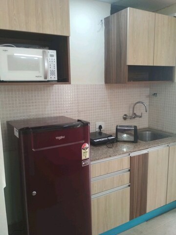 Kitchen in 1 RK Apartment at Supertech Eco Suites, Sector 137 – for Rent