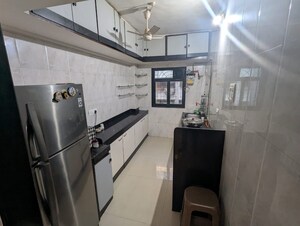 Kitchen in 2 BHK Apartment at Manish Garden CHS, Andheri West – for Rent