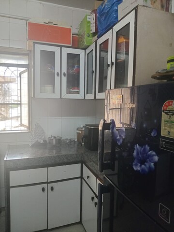 Kitchen in 2 BHK Apartment at Manish Sun Flower Apartment, Andheri West – for Rent